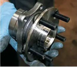  ??  ?? As is usual these days, the bearing comes as a complete assembly that slides over the driveshaft end and bolts on top and bottom.