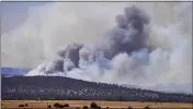  ?? ROBERTO E. ROSALES — THE ALBUQUERQU­E JOURNAL ?? Smoke rises from wildfires near Las Vegas, N.M., on Wednesday.