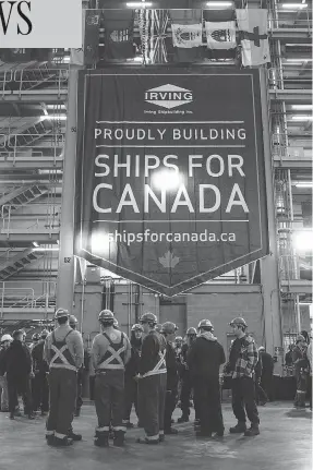  ?? DARREN CALABRESE / THE CANADIAN PRESS ?? Workers gather in the assembly hall at Halifax’s Irving Shipyard Friday, following the announceme­nt that the Navy will receive a sixth Arctic and offshore patrol ship.