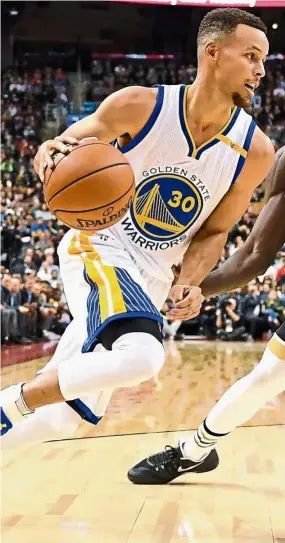  ??  ?? In-form: Stephen Curry scored 35 points in Golden State Warriors’ 127121 win over Toronto Raptors in a NBA game on Wednesday. — AP