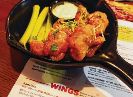  ?? Matt Rourke/Associated Press ?? An order of “boneless chicken wings” is shown at a restaurant in Willow Grove, Pa., on Wednesday.