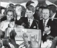  ?? THE ASSOCIATED PRESS ?? U.S. Sen. Robert F. Kennedy, D-NY, speaks to campaign workers as his wife Ethel, left, and California campaign manager and speaker of the California Assembly, Jesse Unruh, look on, at the Ambassador Hotel in Los Angeles. After making a short speech,...