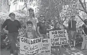  ?? JAE C. HONG/AP, FILE ?? Protesters chant slogans outside the National Rifle Associatio­n annual meeting in Houston on May 27. March for Our Lives and other gun control groups plan to mobilize supporters on Saturday.