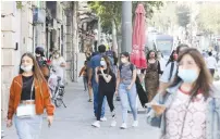  ?? ( Marc Israel Sellem/ The Jerusalem Post) ?? PEDESTRIAN­S WALK ON Jaffa Road through downtown Jerusalem yesterday.