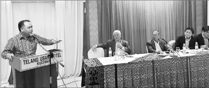  ??  ?? Henry raises a point during the meeting. Seated from left are Allan, Salang and Kilat and Libat.