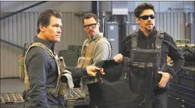  ?? Richard Foreman, Jr. / Associated Press ?? Josh Brolin, from left, Jeffrey Donovan and Benicio Del Toro in “Sicario: Day of the Soldado.”