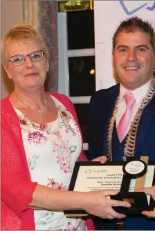  ??  ?? Liam Reilly presents Paulette McArdle with her award.