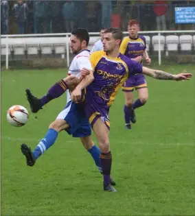  ??  ?? Wexford’s Dale Flynn battles for possession against the Leinster Senior League.