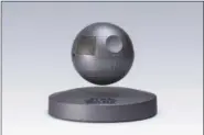  ?? COURTESY OF PLOX VIA AP ?? This photo provided by Plox shows the “Star Wars” Death Star levitating bluetooth speaker. It’s a little tricky to set up, but once you get the Death Star positioned correctly over its base, it floats in the air thanks to well-placed magnets and a...