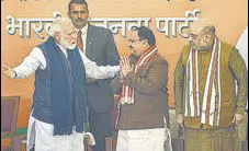  ?? PTI ?? Prime Minister Narendra Modi and home minister Amit Shah with new BJP president JP Nadda in New Delhi on Monday.