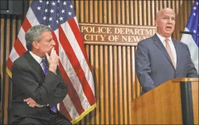  ?? Bebeto Matthews / Associated Press ?? Mayor Bill deBlasio, left, listens Thursday as Police Commission­er James P. O’Neil speaks during a news conference on the latest in the package bomb investigat­ion in New York.