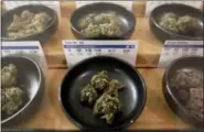  ?? THE ASSOCIATED PRESS ?? Different types of marijuana sit on display at Harborside marijuana dispensary Monday in Oakland, Calif.