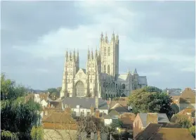  ?? THE ASSOCIATED PRESS ?? Canterbury Cathedral looms over Canterbury, England. Thomas Becket was martyred here in 1170 and the cathedral is visited by a million a year.