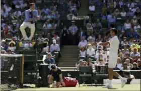  ?? TIM IRELAND — THE ASSOCIATED PRESS ?? Novak Djokovic gestures to umpire Jake Garner as he disputes a call in his men’s singles match with Ernests Gulbis on Saturday.