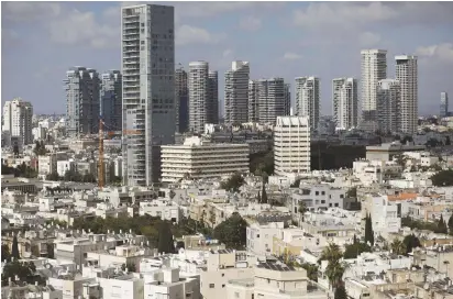  ?? (Reuters) ?? UNAFFORDAB­LE. FOR some Israelis, no matter how much they work they can’t afford to live well in the country and have considered moving abroad.