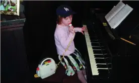  ?? Photograph: The family of Billie Eilish ?? Eilish, performing at home as a child, in a photo taken from her new book Billie Eilish.