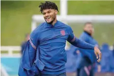  ?? — AFP ?? England’s defender Tyrone Mings laughs during England’s MD-1 training session.