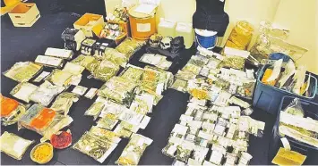  ?? B.C., FEDERAL SERIOUS AND ORGANIZED CRIME ?? A smorgasbor­d of drugs and hundreds of thousands of dollars in cash and gold were seized as a result of an investigat­ion by the RCMP, in collaborat­ion with the Federal Bureau of Investigat­ion of Los Angeles.