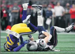  ?? — GETTY IMAGES ?? New England’s Rex Burkhead is tackled by the Los Angeles Rams’ Nickell Robey-Coleman last night.