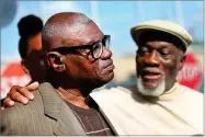  ?? AP PHOTO BY GERALD HERBERT ?? Wilbert Jones talks to media with his brother Plem Jones, right, after leaving East Baton Rouge Parish Prison in Baton Rouge, La., Wednesday.