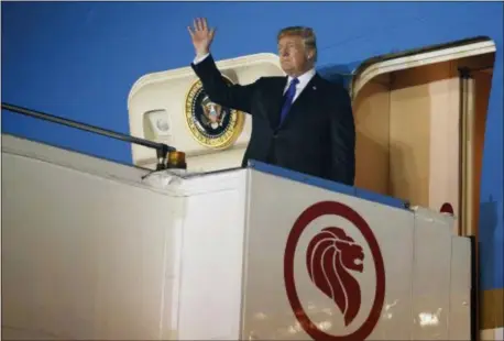  ?? AP PHOTO/EVAN VUCCI ?? President Donald Trump arrives at Paya Lebar Air Base for a summit with North Korea’s leader Kim Jong Un, Sunday, June 10, 2018, in Singapore.