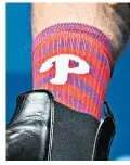  ?? ?? Joe Biden, who was born in Pennsylvan­ia, shows off his Phillies socks as he speaks at a reception