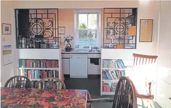  ??  ?? A kitchen dining area has interestin­g features and lots of storage for books and other treasures