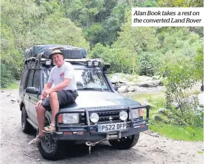  ??  ?? Alan Book takes a rest on the converted Land Rover