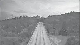  ?? MARK J. TERRILL/AP ?? Empty lanes of the 110 Arroyo Seco Parkway that leads to downtown Los Angeles are seen last month during the coronaviru­s outbreak in Los Angeles.