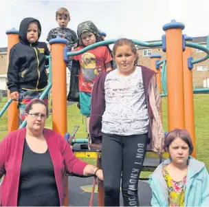  ??  ?? Zoe Williams with her children Isabel Williams, aged 9, Rihanna Williams, 8 and AJ Williams, 6, along with youngsters Carla Richards, 10, and Logan McMaster, 8, at the children’s park in Dan y Banc Llanelli.