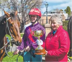  ?? Pictures: Alastair Bett ?? Tasmanians got a taste of the Cup including Jenny Hodder and horse Federal Member (above, left), Ashley and Lindy Goggin of Hobart (above) and John Mills and Persia Hope of Sorrel (below).