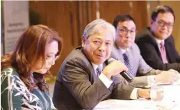  ??  ?? PAL President and Chief Operating Officer Jaime J. Bautista (second from left) answers questions from the media during the airline’s new year press conference held at the Century Park Hotel in Malate, Manila yesterday. He is flanked by (from left): Ria Domingo, VP for marketing; Nickey Gozon, SVP for airline operations; and Ryan Uy, VP sales.(Photo by Ali Vicoy.