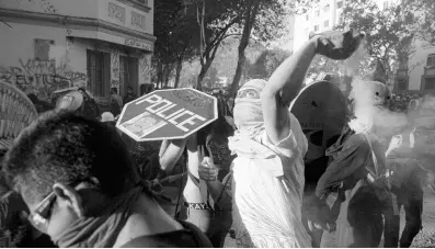  ?? AP ?? Anti-government protesters clash with police in Santiago, Chile, on Monday, November 18. Chileans have been demonstrat­ions over inequality and better social services.