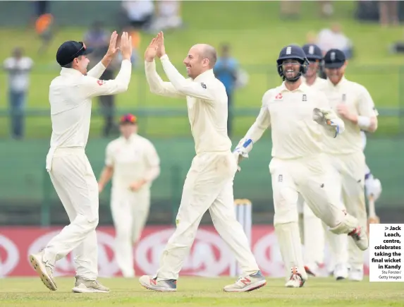  ?? Stu Forster/ Getty Images ?? &gt; Jack Leach, centre, celebrates taking the final wicketin Kandy