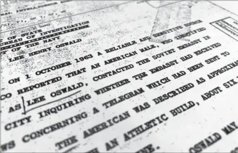  ?? JON ELSWICK — THE ASSOCIATED PRESS ?? Part of a file from the CIA, dated details “a reliable and sensitive source in Mexico” report of Lee Harvey Oswald’s contact with the Soviet Union embassy in Mexico City, that was released for the first time on Friday by the National Archives.