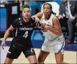  ?? SARAH GORDON/THE DAY ?? UConn’s Megan Walker (3) guards Cincinnati’s Angel Rizor (4) as they watch for the rebound during the AAC tournament championsh­ip game on March 9 at Mohegan Sun Arena.