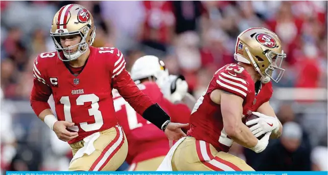  ?? ?? GLENDALE: (FILES) Quarterbac­k Brock Purdy #13 of the San Francisco 49ers hands the football to Christian McCaffrey #23 during the NFL game at State Farm Stadium in Glendale, Arizona. — AFP