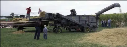  ?? CONTRIBUTE­D PHOTO ?? A thresher is demonstrat­ed during a previous Rentown Old Fashion Days. The event is Saturday, Sept. 7, and Sunday, Sept. 8, this year.