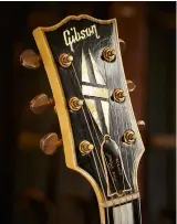  ??  ?? OppOsItE By 1962, Gibson dropped the Deluxe vibrato, replacing it with the much more usable Maestro unit. For ’62 only, Maestros feature a mother-of-pearl inlaid ebony block