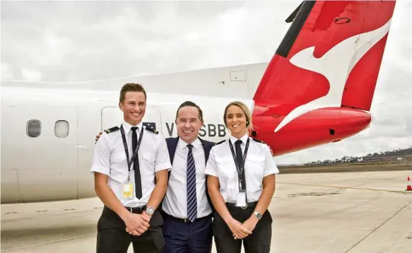  ?? Photo: Nev Madsen ?? FUTURE STUDENTS: At the launch of the Qantas Academy two weeks ago are (from left) USQ aviation student Tom Fanshawe, Qantas CEO Alan Joyce and student Kimberley Pike. The students are likely to learn to fly during all hours of the day and night if they’re accepted into the Qantas Pilot Academy.