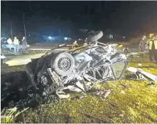  ??  ?? The wrecked car after falling from the flyover near Kota Kinabalu Internatio­nal Airport.