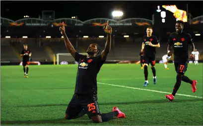  ??  ?? Odion Ighalo celebrates in the empty stadium after scoring Manchester United’s first goal