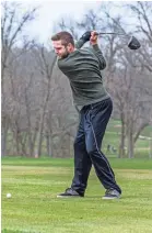  ?? SCOTT ASH / NOW NEWS GROUP ?? Zach Tranchita of Milwaukee tees off at Wanaki Golf Course in Menomonee Falls on April 24, the day courses across the state were allowed to open in accordance with Gov. Tony Evers' revised safer-at-home order.