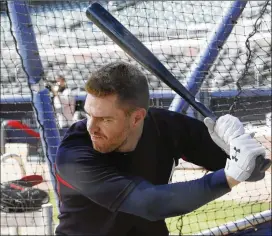  ?? BOB ANDRES / BANDRES@AJC.COM ?? Braves first baseman Freddie Freeman takes some swings in the batting cage during the team’s workout at SunTrust Park on Tuesday.