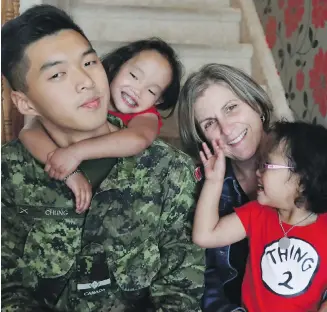  ?? LARS HAGBERG, THE CANADIAN PRESS ?? Kris Chung, Binh Wagner, mom Johanne Wagner and Phuoc Wagner (left to right) pose for a portrait in Kingston, Ont. Kris donated part of his liver in April 2015 to help save Binh.