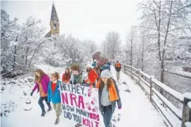  ?? Anna Stonehouse, The Aspen Times ?? Aspen High School students march to Paepcke Park for a student-organized walkout protesting gun violence, Friday, April 20, 2018, in Aspen, Colo. Students across the country streamed out of their schools in the latest round of gun-control activism...