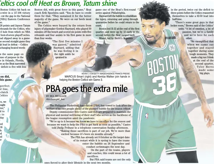  ?? KEVIN C. COX/GETTY IMAGES/AGENCE FRANCE-PRESSE ?? MARCUS Smart (right) and Kemba Walker join hands in helping the Boston Celtics win Game 3.