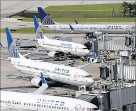  ?? David J. Phillip Associated Press ?? FLIERS WHO forgo coach fares for basic economy seats on United Airlines may save a little cash, but they can’t bring a carry-on bag unless it fits under the seat.