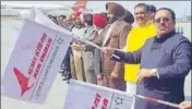  ?? HT PHOTO ?? Union minister Vijay Sampla (yellow jacket), flanked by Rajya Sabha member Shwait Malik (right) and MP Gurjeet Singh Aujla, flagging off the flight in Amritsar on Tuesday.