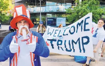  ?? MARTTI KAINULAINE­N/LEHTIKUVA ?? Teppo Marttila, dressed as Uncle Sam, participat­es in a demonstrat­ion by the True Finns youth members in support of President Donald Trump, in Helsinki, Finland, on Sunday.